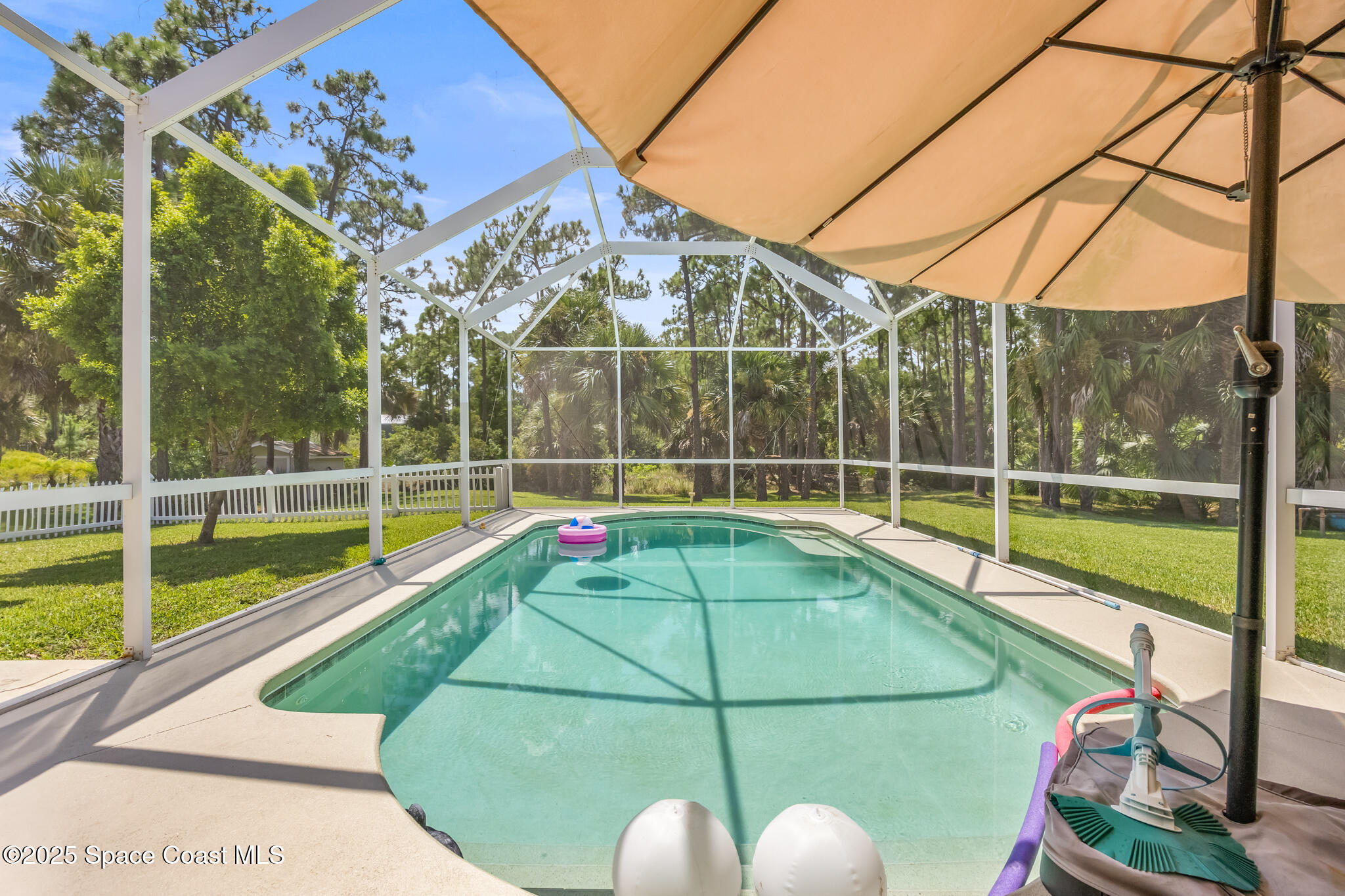 7210 Wando Avenue Grant, FL 32949 - Photo 9 of 41 a view of a backyard with a swimming pool
