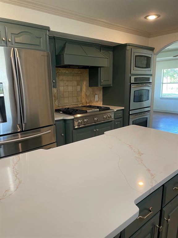 14140 Highway 78 Blue Ridge, TX 75424 - Photo 15 of 30 a kitchen with stainless steel appliances a refrigerator and a stove