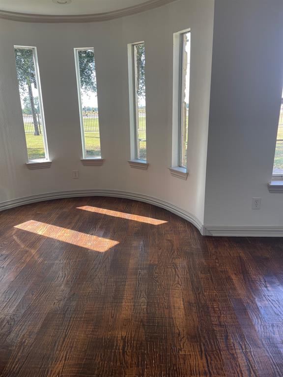 14140 Highway 78 Blue Ridge, TX 75424 - Photo 17 of 30 a view of empty room with wooden floor and fan
