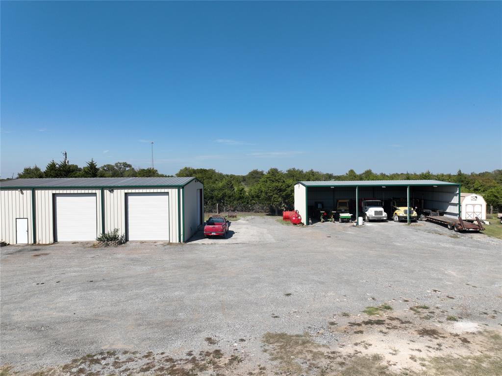 14140 Highway 78 Blue Ridge, TX 75424 - Photo 7 of 30 a view of a house with large space and large trees
