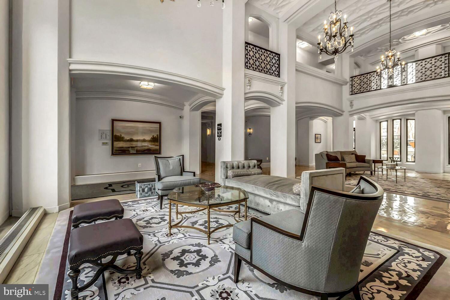1701 16th Street Northwest, Unit 710 Washington, DC 20009 - Photo 3 of 30 a living room with furniture and a chandelier