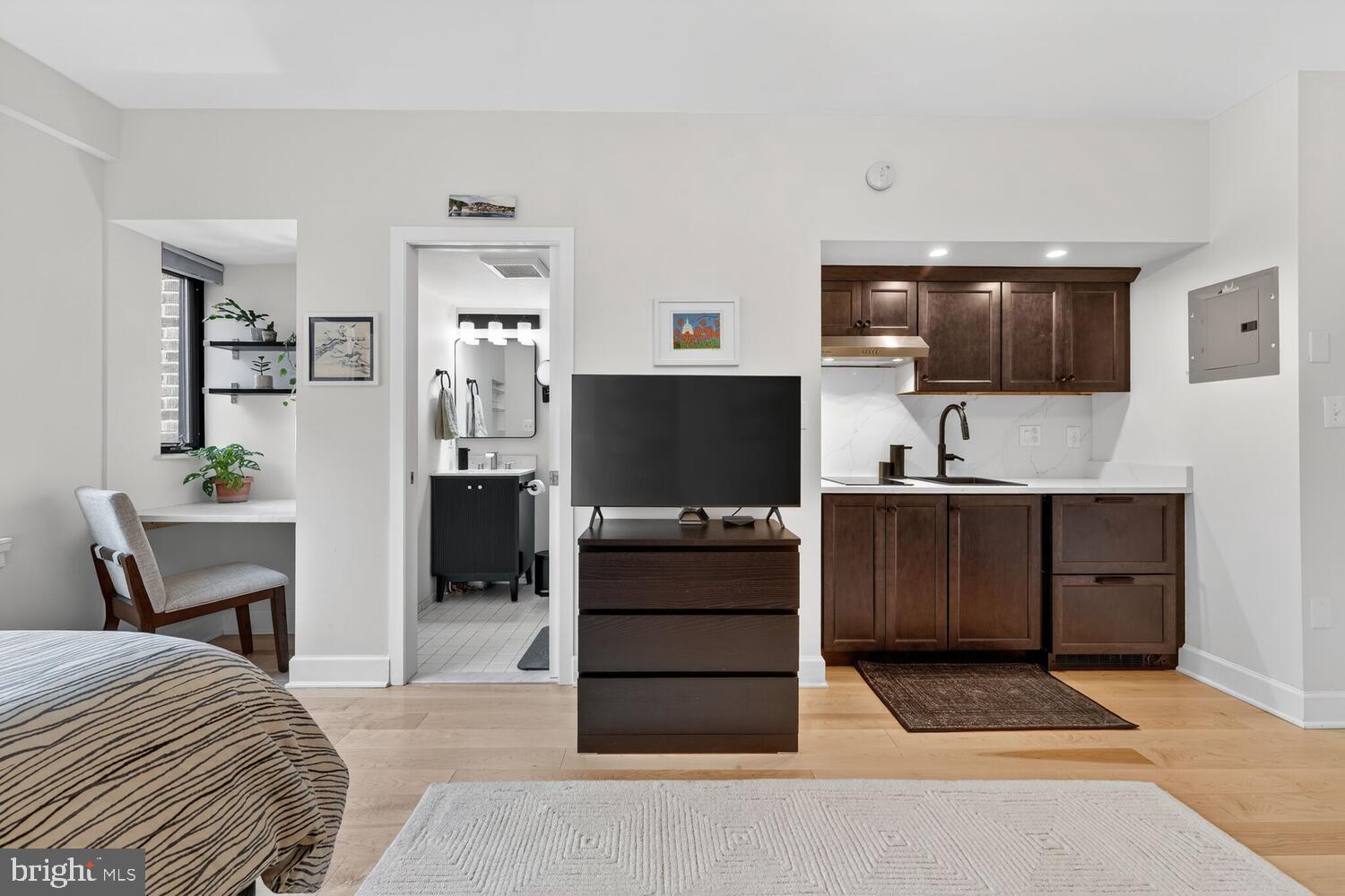 1701 16th Street Northwest, Unit 710 Washington, DC 20009 - Photo 9 of 30 a bedroom with a bed and furniture
