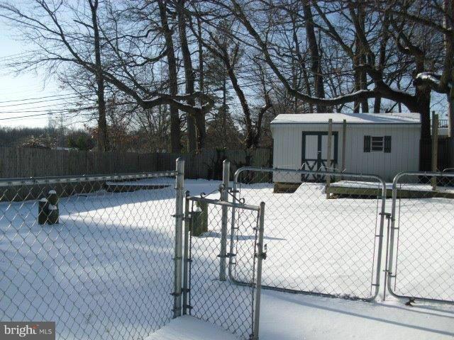 406 Old Home Road Baltimore, MD 21206 - Photo 3 of 11 a view of a white house with wooden fence