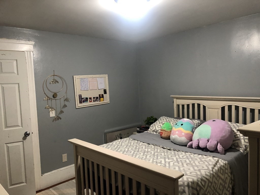 30-32 Beaconsfield Road Worcester, MA 01602 - Photo 2 of 10 a bedroom with a bed and a table