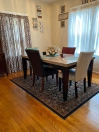 30-32 Beaconsfield Road Worcester, MA 01602 - Photo 3 of 10 a view of a dining room with furniture and wooden floor