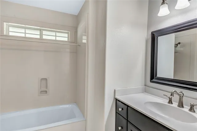 a bathroom with a sink and a bathtub