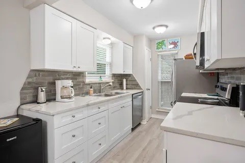 2003 North Fulton Beach Road, Unit 43 Rockport, TX 78382 - Photo 6 of 30 Kitchen cabinets offer lots of storage and deep drawers. Small refrigerator also stays with property.