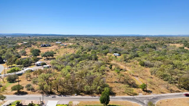 an aerial view of a house with a city view