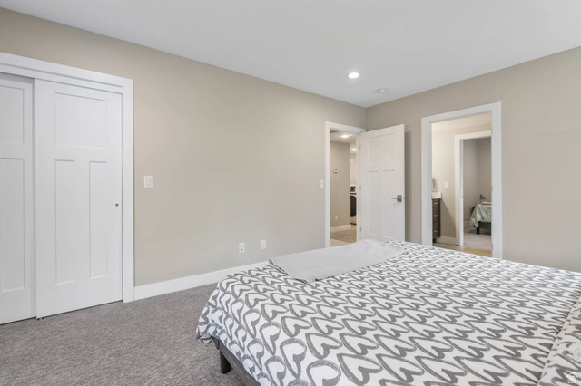 4527 North Seven Bridges Road Eden, UT 84310 - Photo 31 of 65 Bedroom with light colored carpet, recessed lighting, and a closet