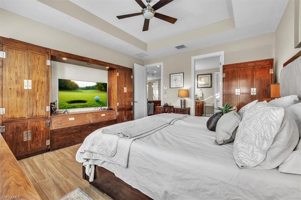 16424 Windsor Way Alva, FL 33920 - Photo 19 of 50 a bedroom with a bed and a flat screen tv