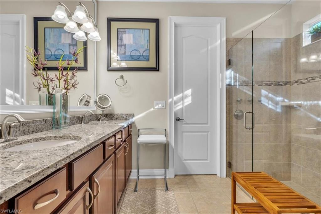 16424 Windsor Way Alva, FL 33920 - Photo 22 of 50 a bathroom with a granite countertop sink and a mirror