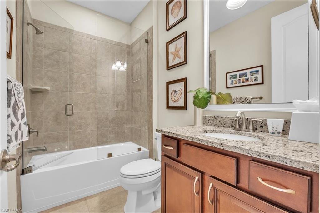 16424 Windsor Way Alva, FL 33920 - Photo 28 of 50 a bathroom with a granite countertop sink a toilet and bathtub