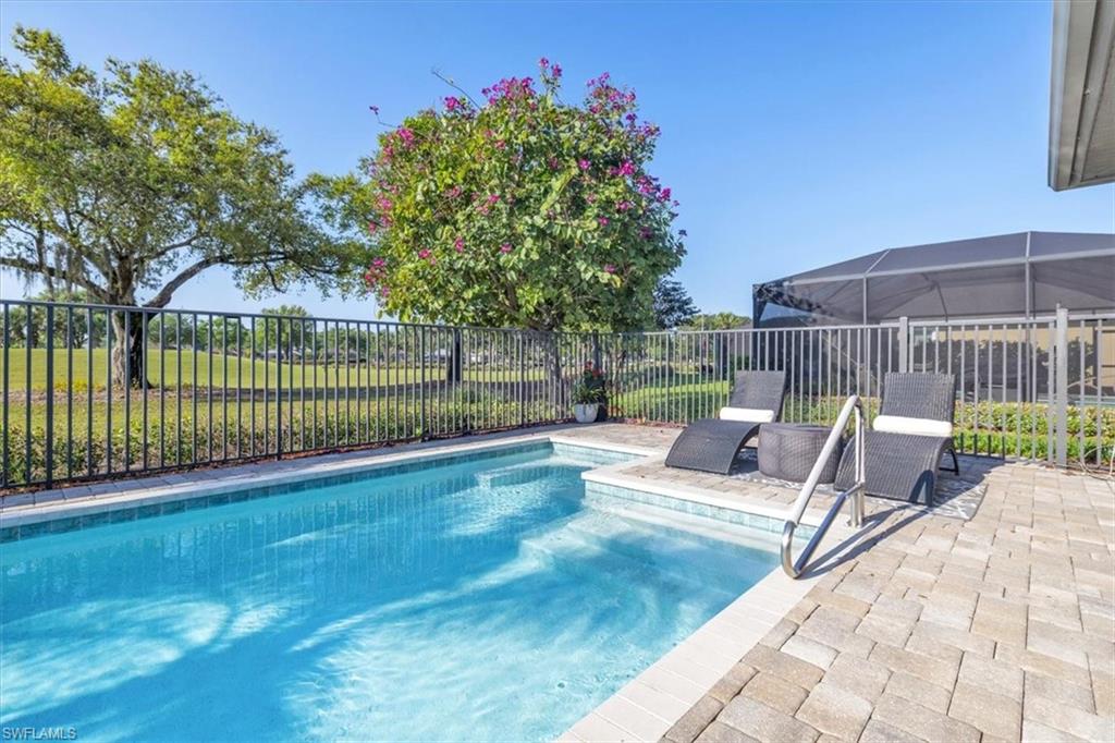 16424 Windsor Way Alva, FL 33920 - Photo 30 of 50 a view of a backyard with a garden and deck