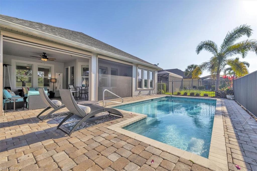 16424 Windsor Way Alva, FL 33920 - Photo 32 of 50 a view of a swimming pool with sitting area