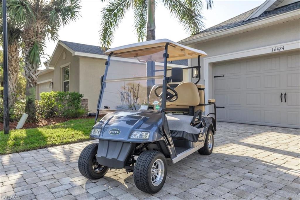 16424 Windsor Way Alva, FL 33920 - Photo 37 of 50 a view of backyard with barbeque grill and a fountain