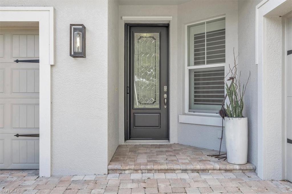 16424 Windsor Way Alva, FL 33920 - Photo 7 of 50 a view of a hallway with windows and closet