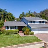 a house view with a garden space