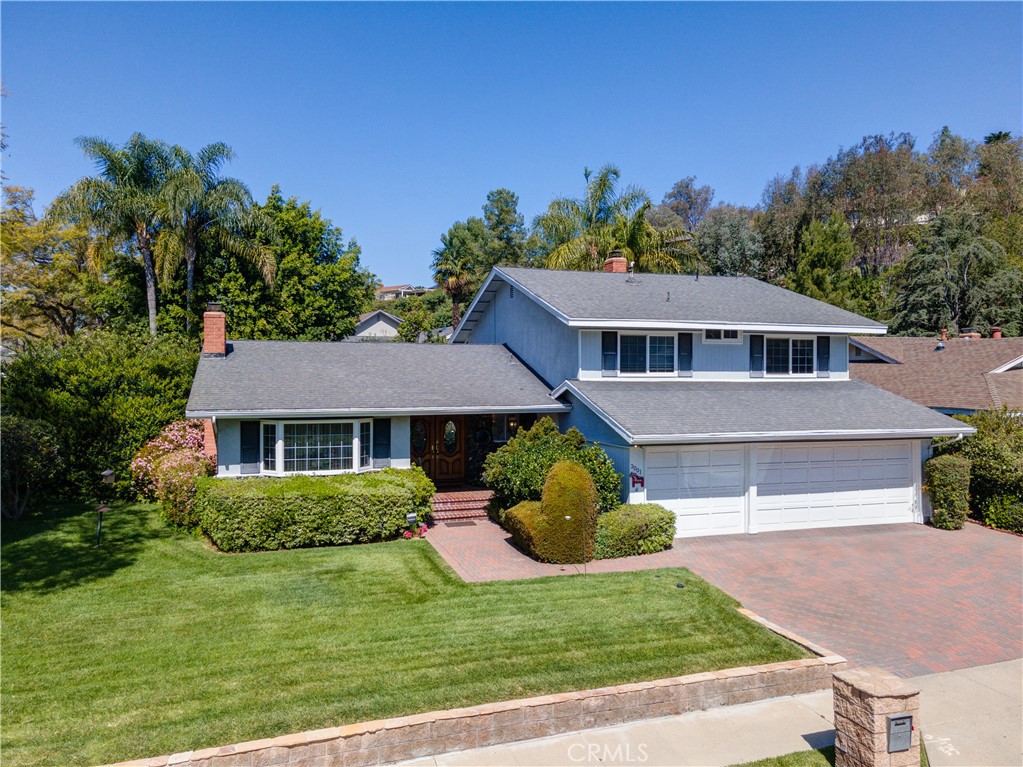 a house view with a garden space