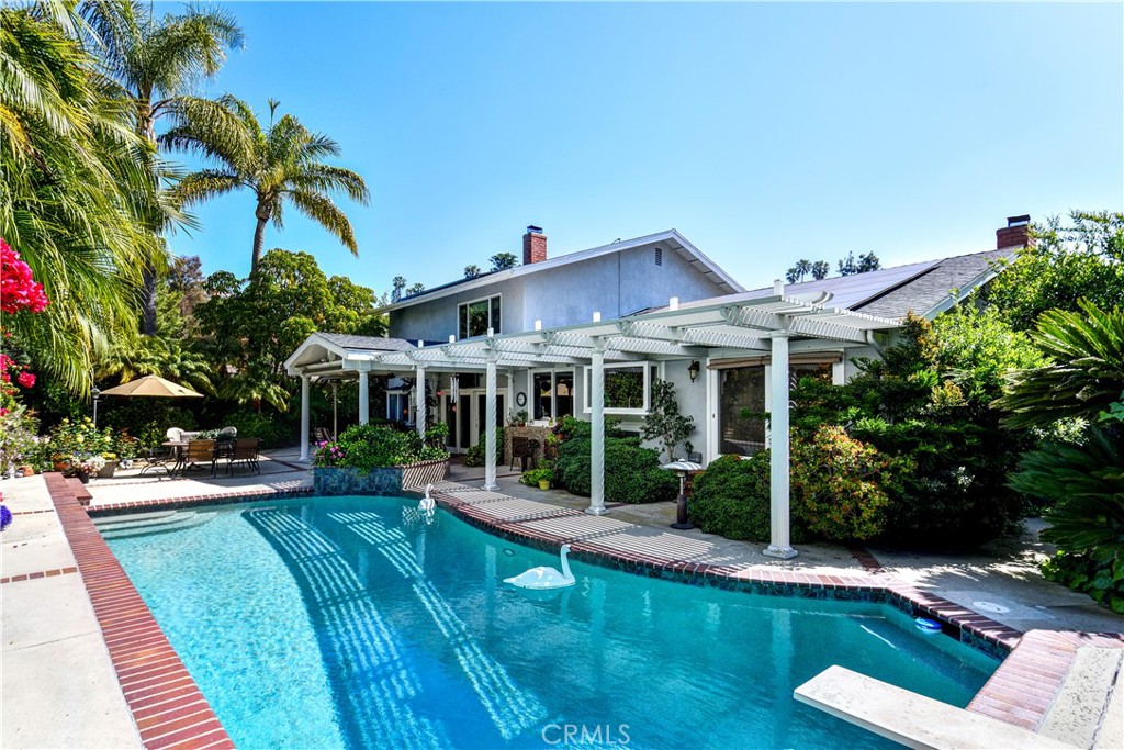 3001 Valera Fullerton, CA 92835 - Photo 24 of 25 a front view of a house with a yard table and chairs