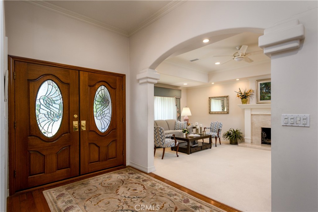 3001 Valera Fullerton, CA 92835 - Photo 3 of 25 a living room with furniture a mirror and a fireplace