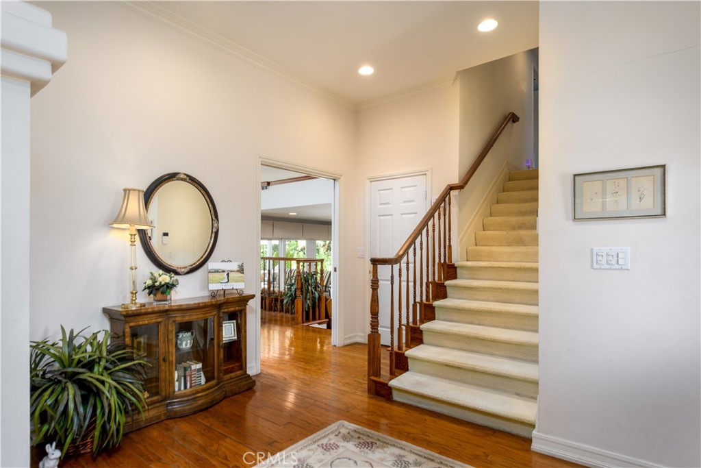 3001 Valera Fullerton, CA 92835 - Photo 4 of 25 a living room with furniture a mirror and a clock