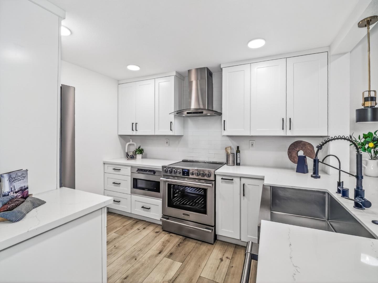 2084 Foxhall Loop San Jose, CA 95125 - Photo 13 of 44 a kitchen with stainless steel appliances granite countertop a sink stove and refrigerator