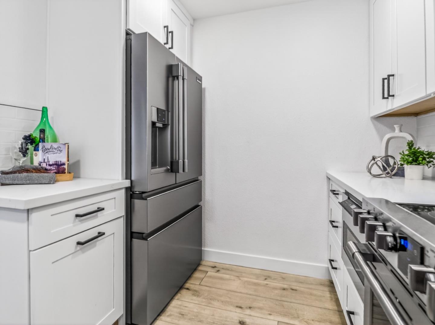 2084 Foxhall Loop San Jose, CA 95125 - Photo 15 of 44 a kitchen with stainless steel appliances a refrigerator and cabinets