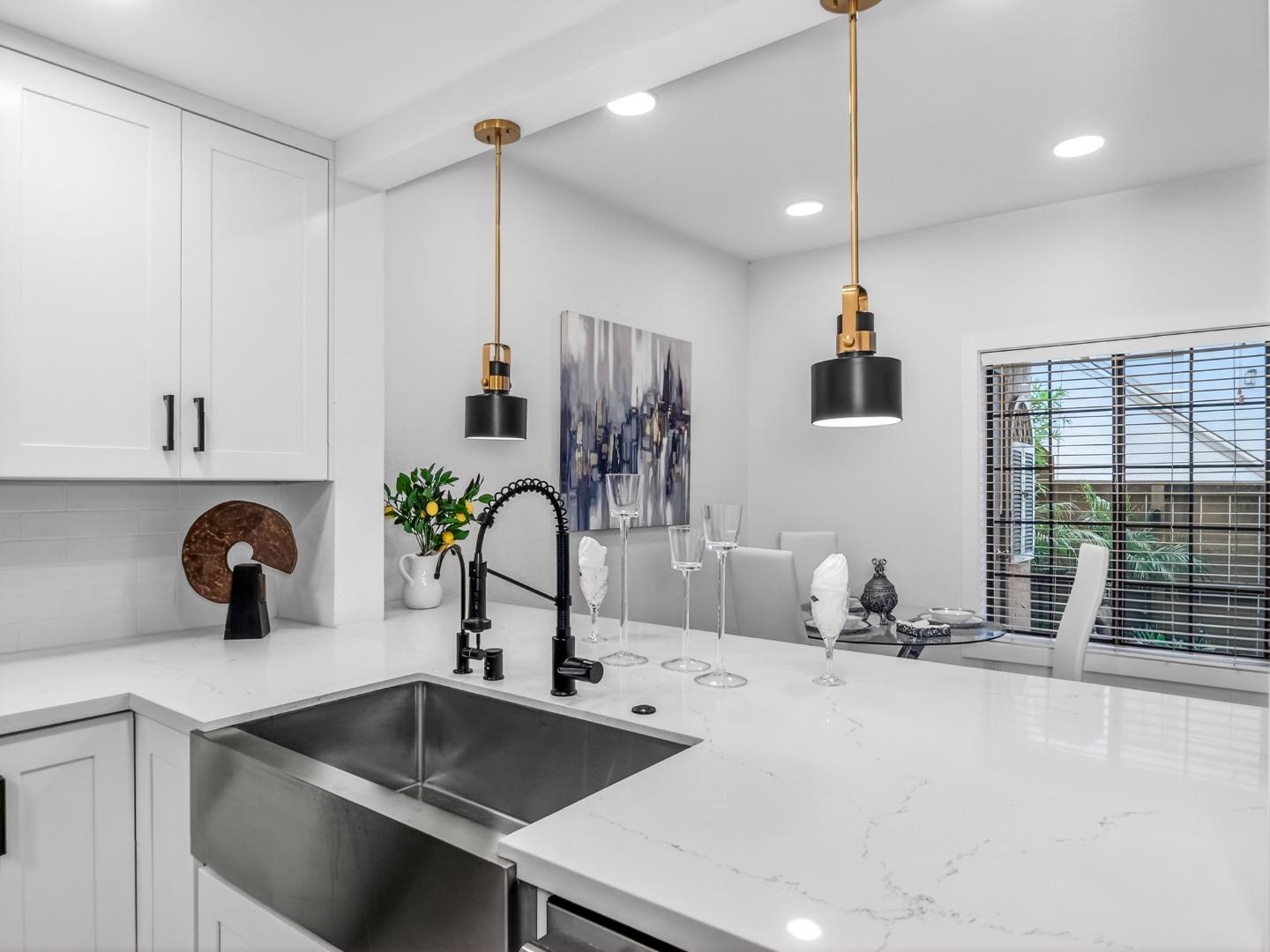 2084 Foxhall Loop San Jose, CA 95125 - Photo 16 of 44 a kitchen with a sink a counter and chairs