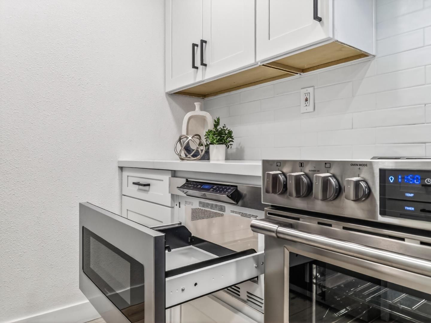 2084 Foxhall Loop San Jose, CA 95125 - Photo 18 of 44 a stove top oven sitting inside of a kitchen