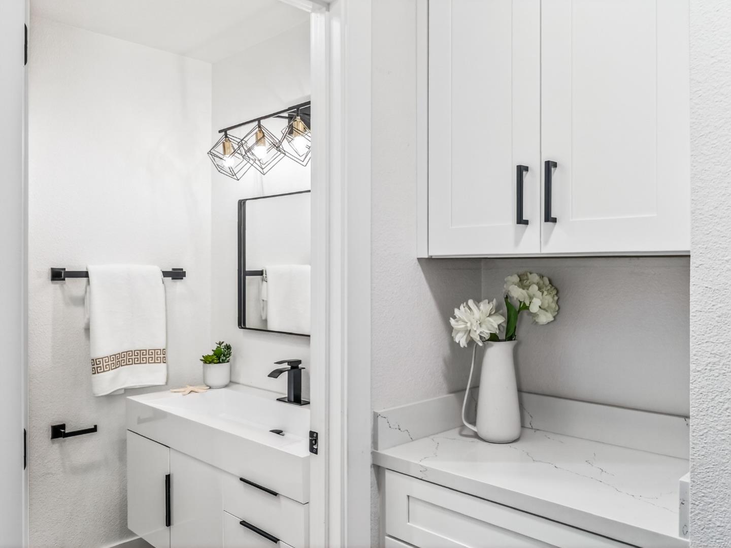 2084 Foxhall Loop San Jose, CA 95125 - Photo 22 of 44 a bathroom with a sink and mirror
