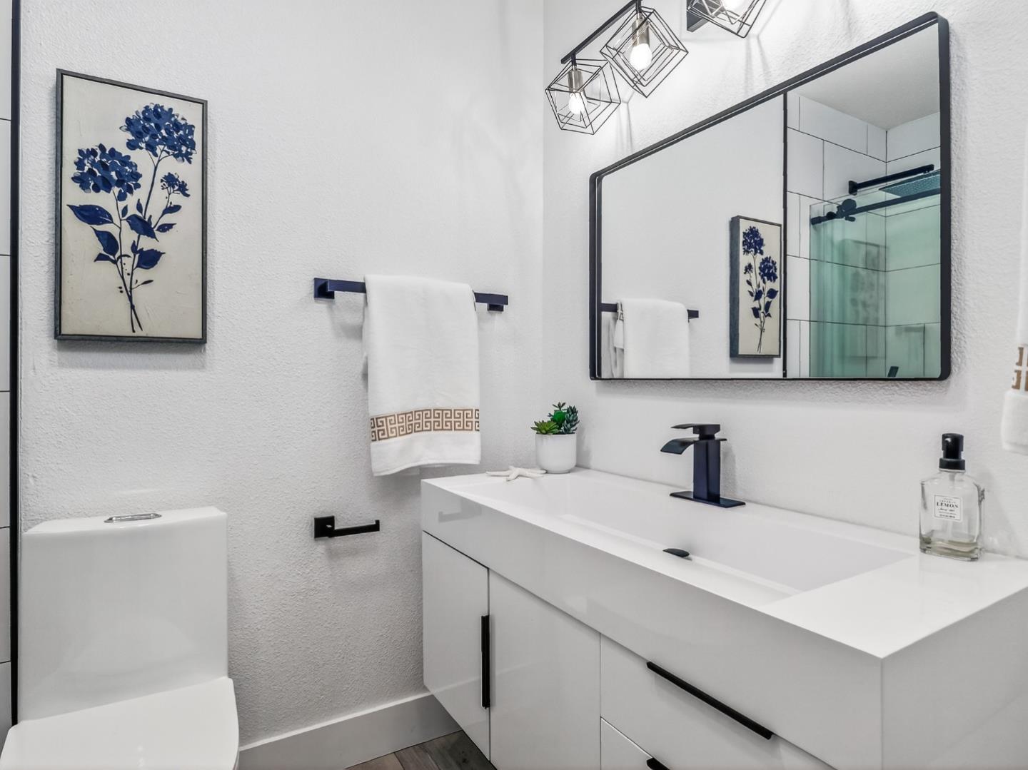 2084 Foxhall Loop San Jose, CA 95125 - Photo 23 of 44 a bathroom with a sink a toilet and mirror