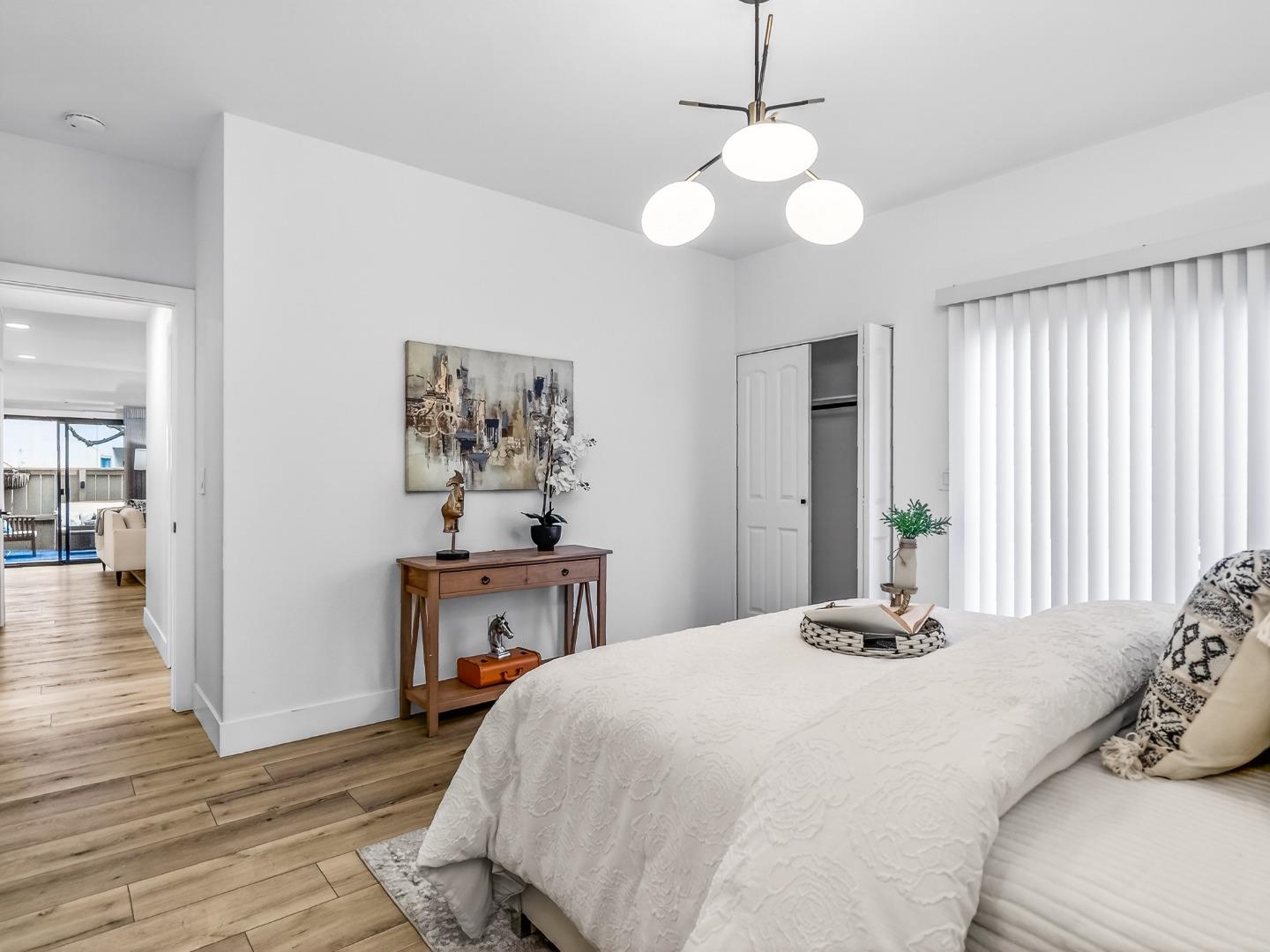 2084 Foxhall Loop San Jose, CA 95125 - Photo 31 of 44 a bedroom with a bed and wooden floor