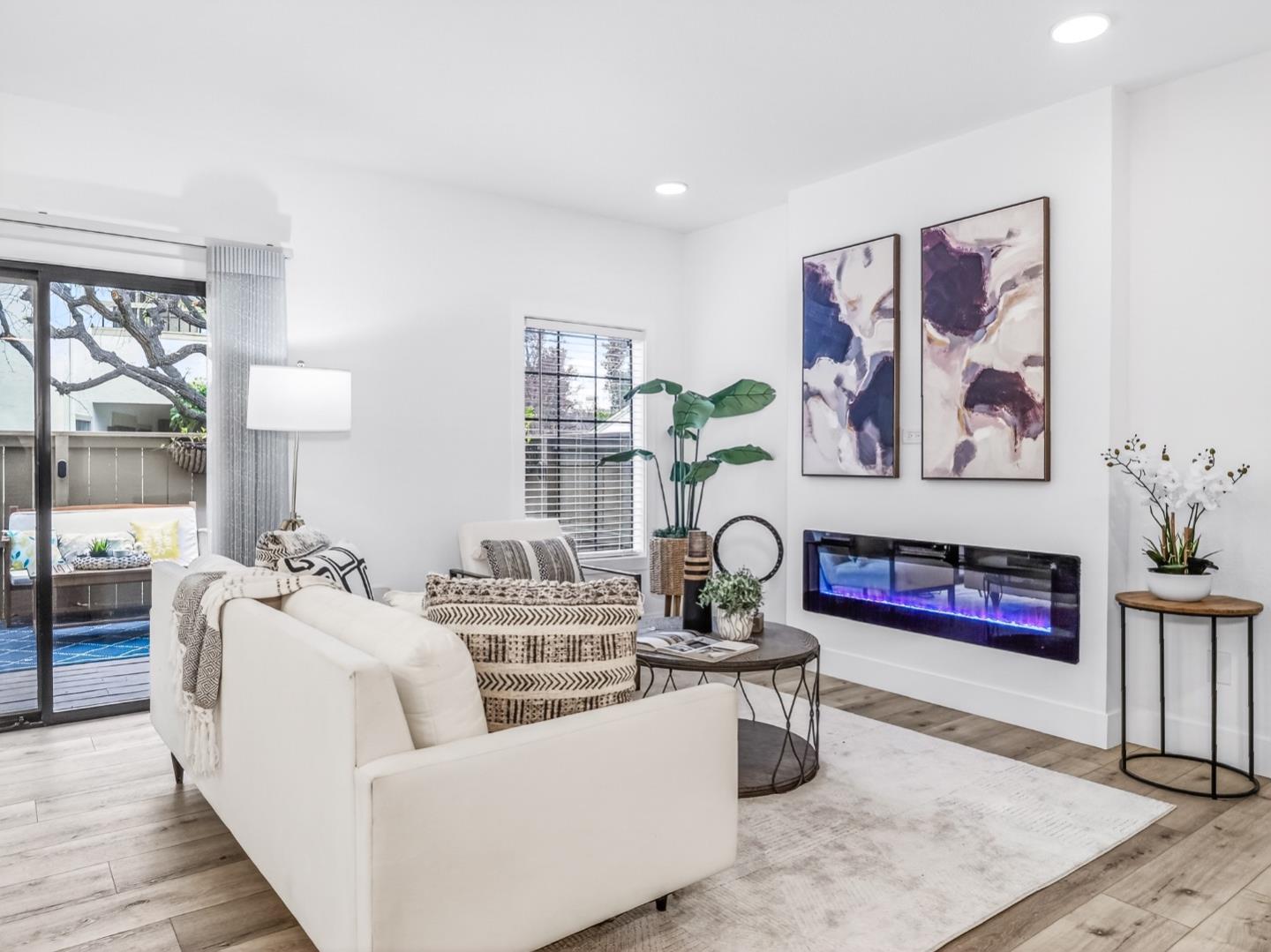 2084 Foxhall Loop San Jose, CA 95125 - Photo 4 of 44 a living room with furniture and painting on the wall next to a window
