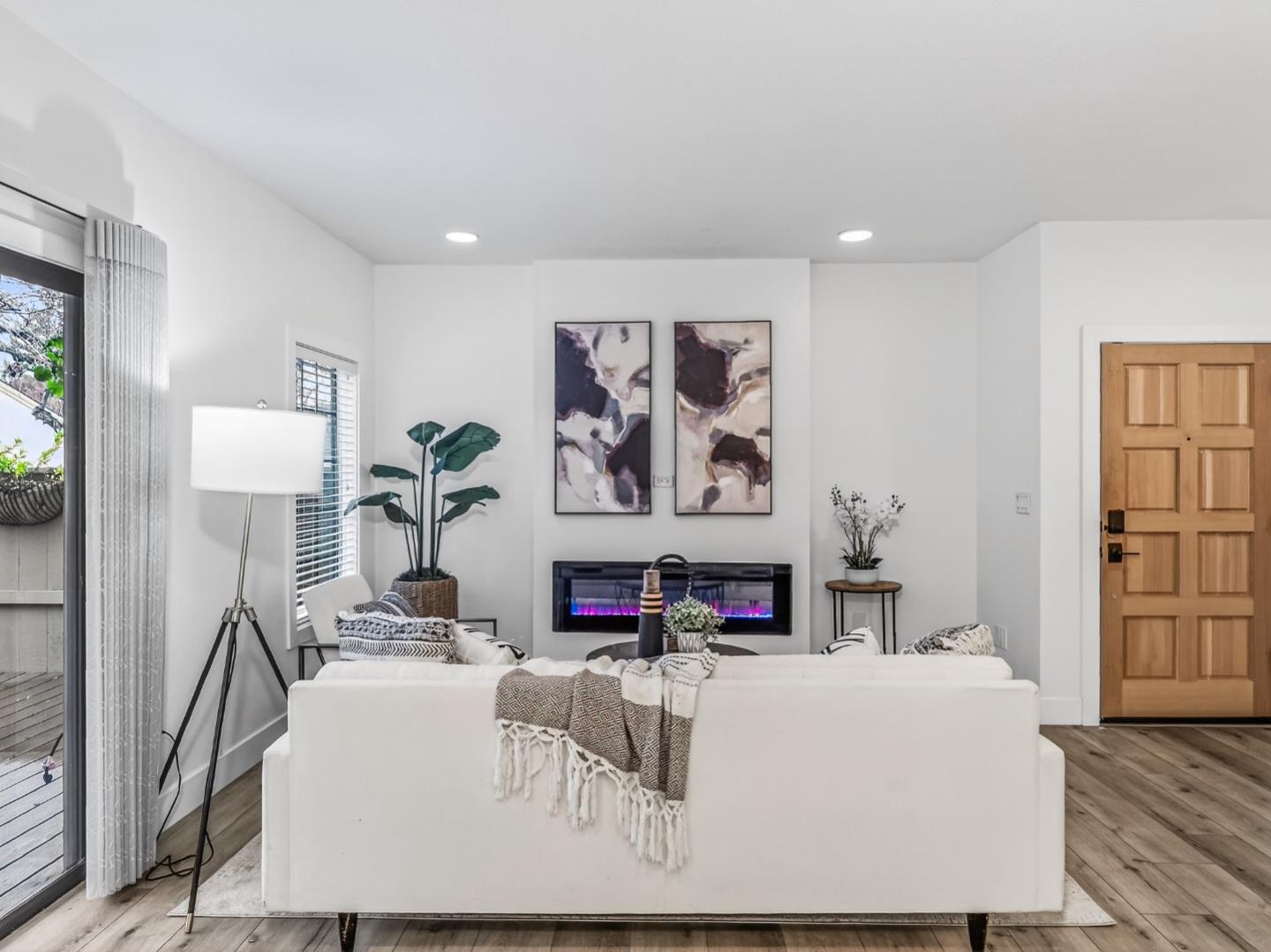 2084 Foxhall Loop San Jose, CA 95125 - Photo 7 of 44 a living room with fireplace furniture and a flat screen tv