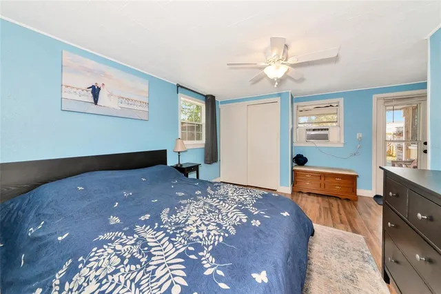 a workspace with wooden floor and a window