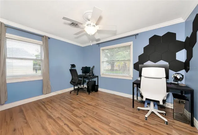 a bathroom with a granite countertop toilet sink and mirror