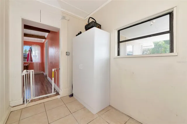 an aerial view of a house with swimming pool outdoor seating