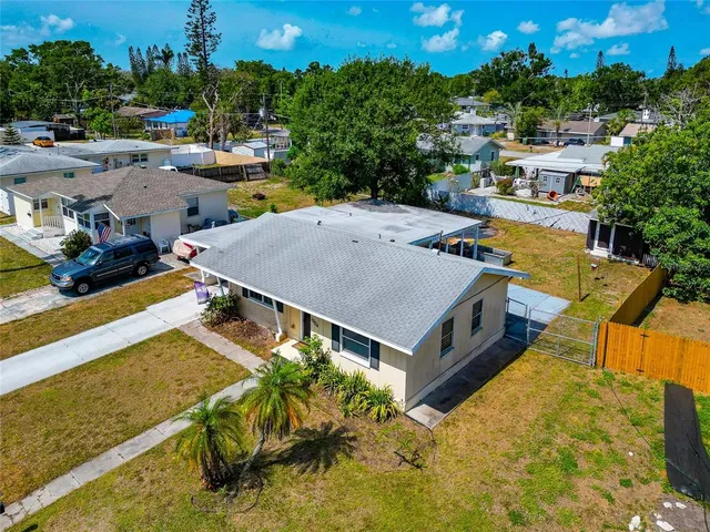 an aerial view of a house with a garden