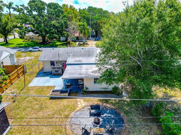 an aerial view of a house with a swimming pool