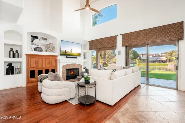 a view of a dining room with furniture a rug and wooden floor