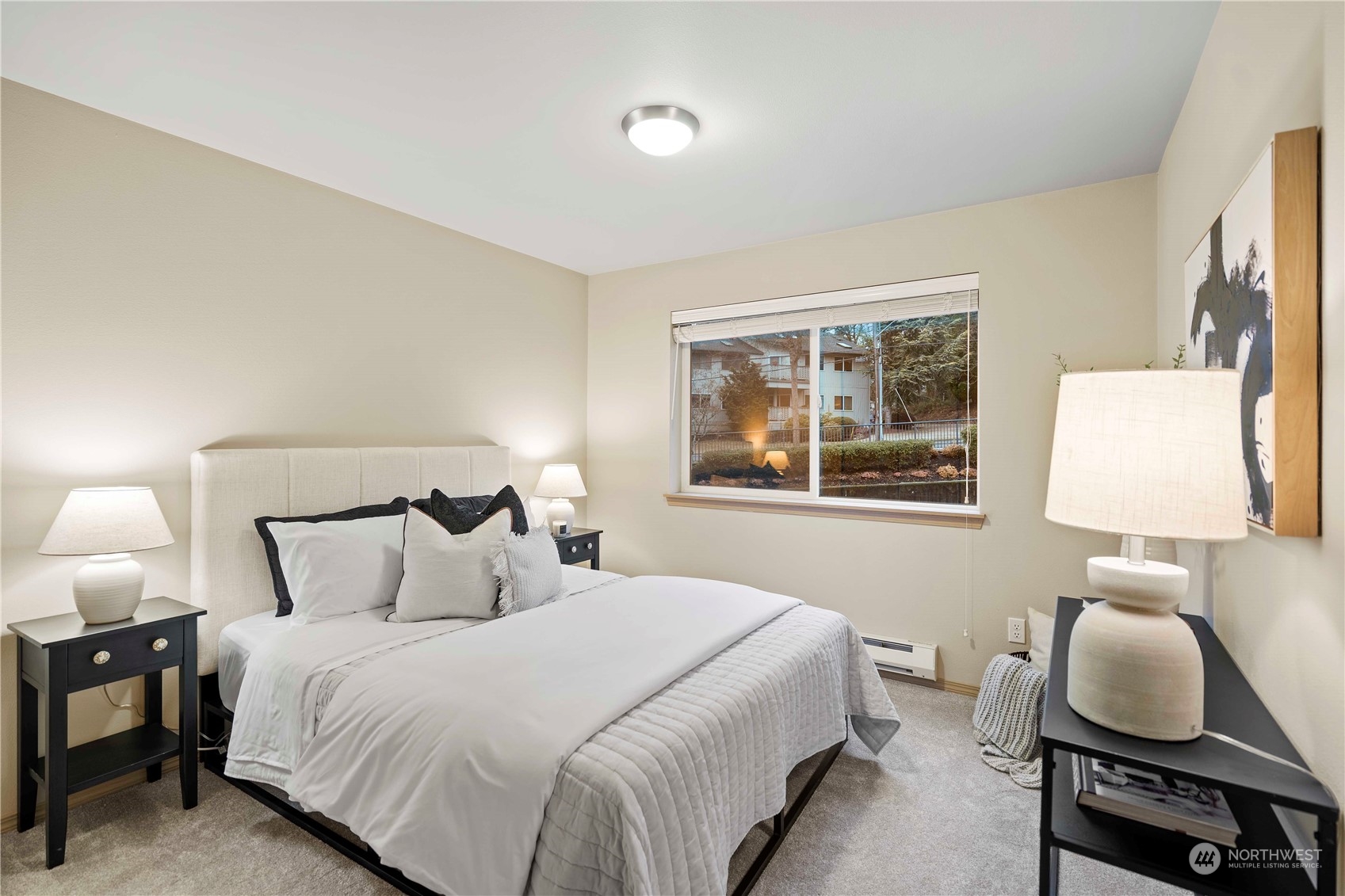 10709 Valley View Road, Unit B302 Bothell, WA 98011 - Photo 12 of 20 a bedroom with a bed and window