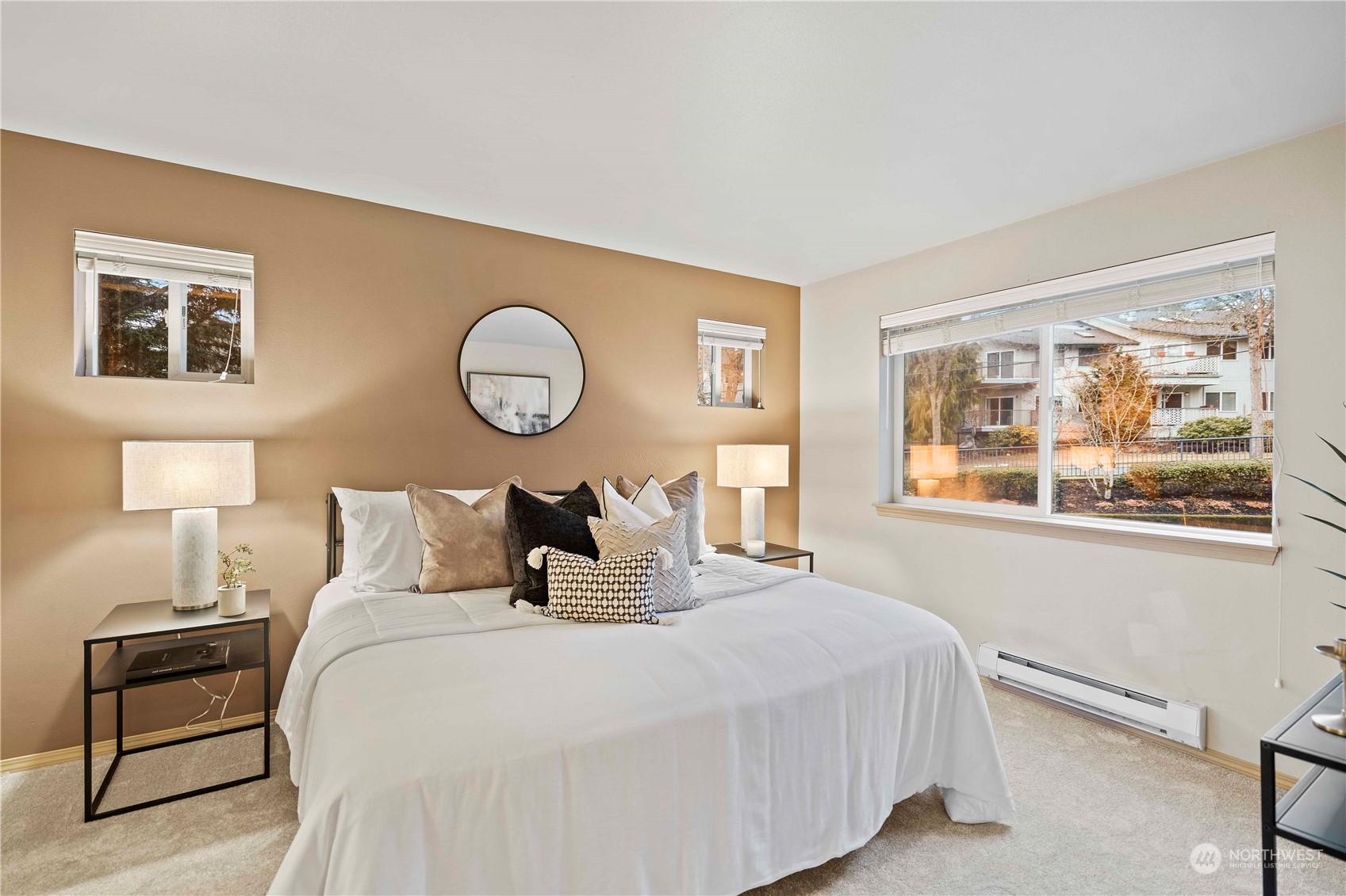 10709 Valley View Road, Unit B302 Bothell, WA 98011 - Photo 14 of 20 a bedroom with a bed and a lamp