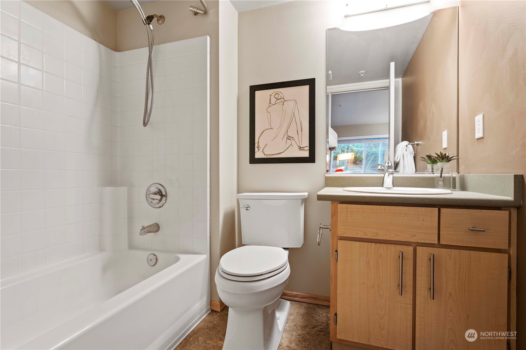 10709 Valley View Road, Unit B302 Bothell, WA 98011 - Photo 17 of 20 a bathroom with a toilet sink and mirror