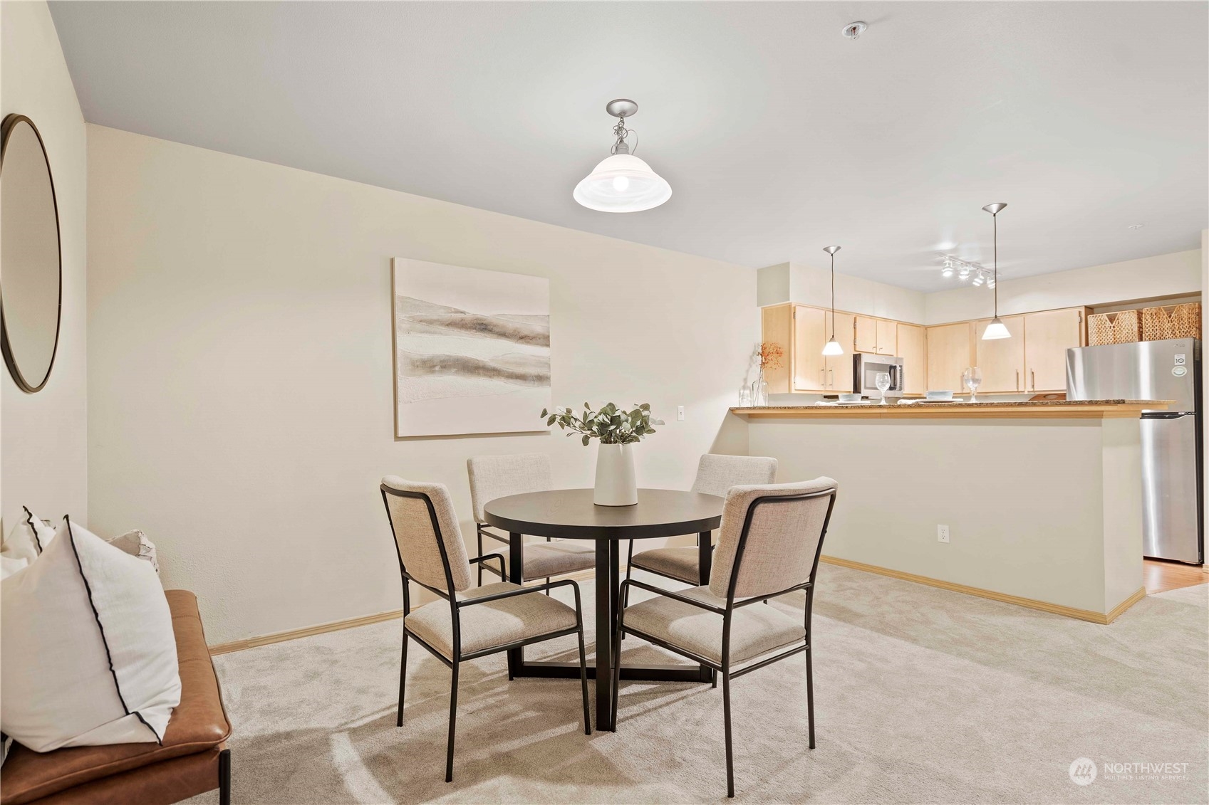 10709 Valley View Road, Unit B302 Bothell, WA 98011 - Photo 6 of 20 a dining room with furniture and window