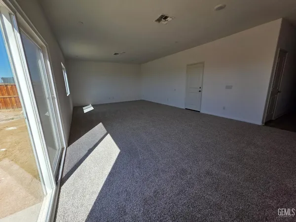 a view of a big room with staircase