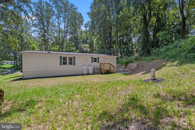 a house view with a backyard space