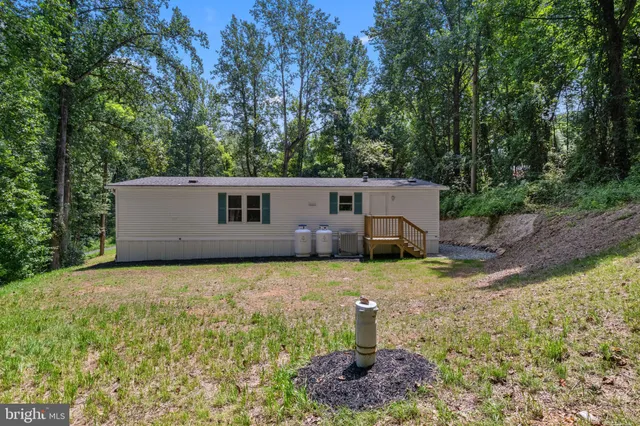 a house view with a backyard space