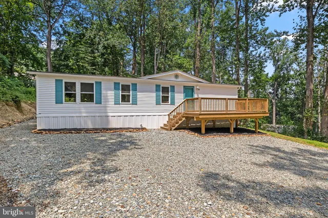 a house with trees in the background