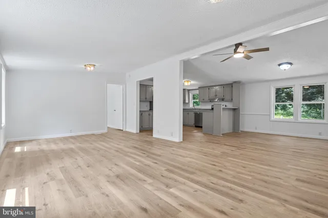 a view of a kitchen with a stove and a window