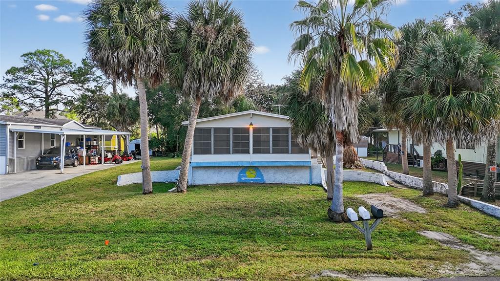 1034 Baillies Bluff Road Holiday, FL 34691 - Photo 1 of 1 a front view of a house with garden